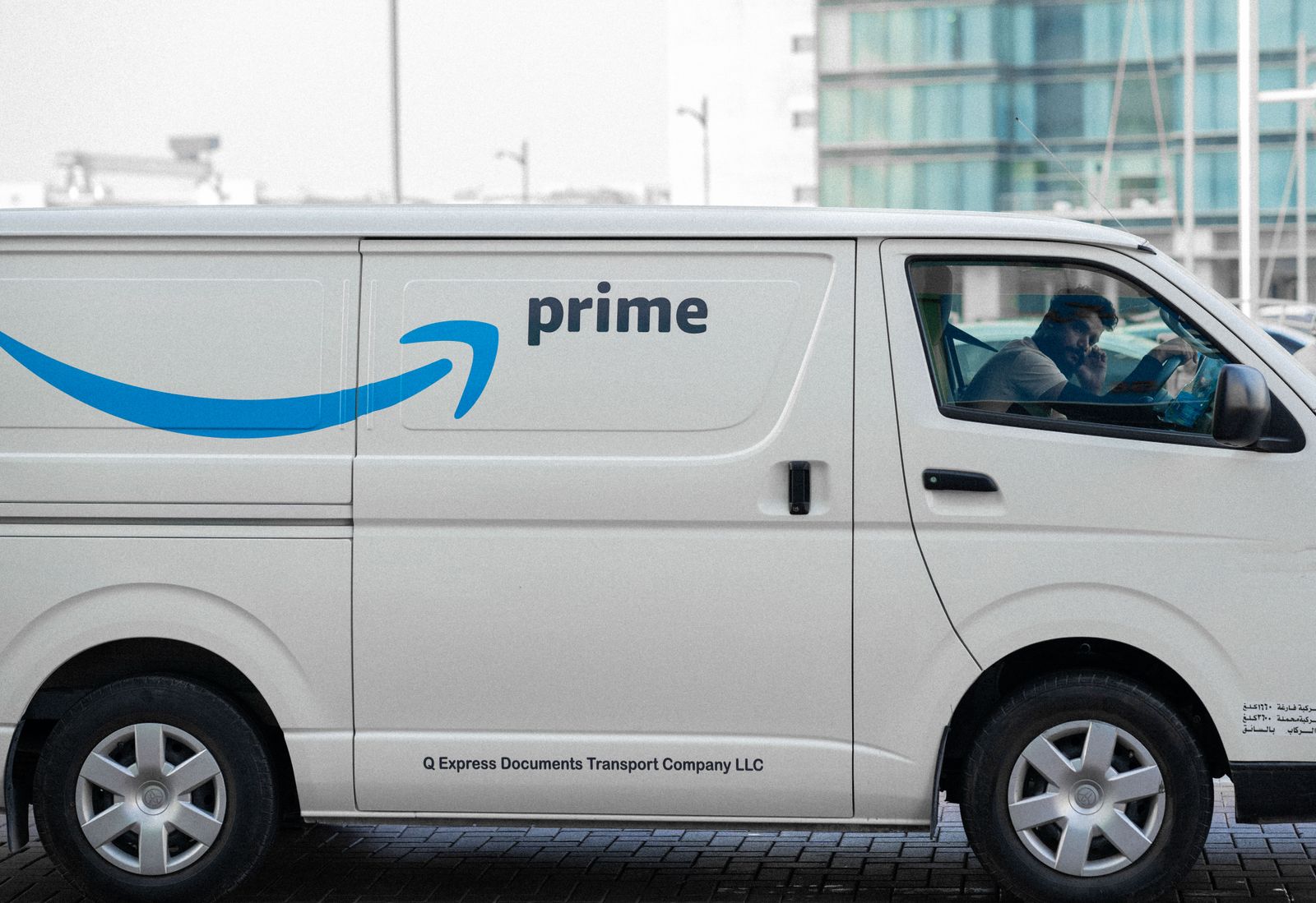 A liveried work van outside a client site